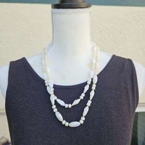 long iridescent white beaded necklace